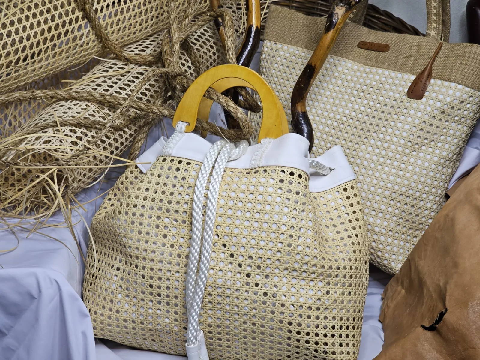 Cane-weave bag with fabric and leather detailing